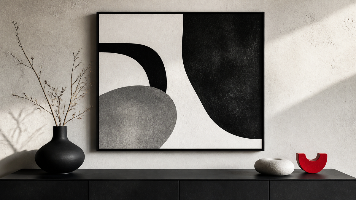 Large monochrome abstract artwork styled above a charcoal console