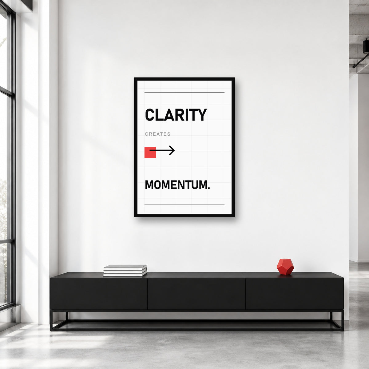Clarity Creates Momentum wall art styled in a creative studio