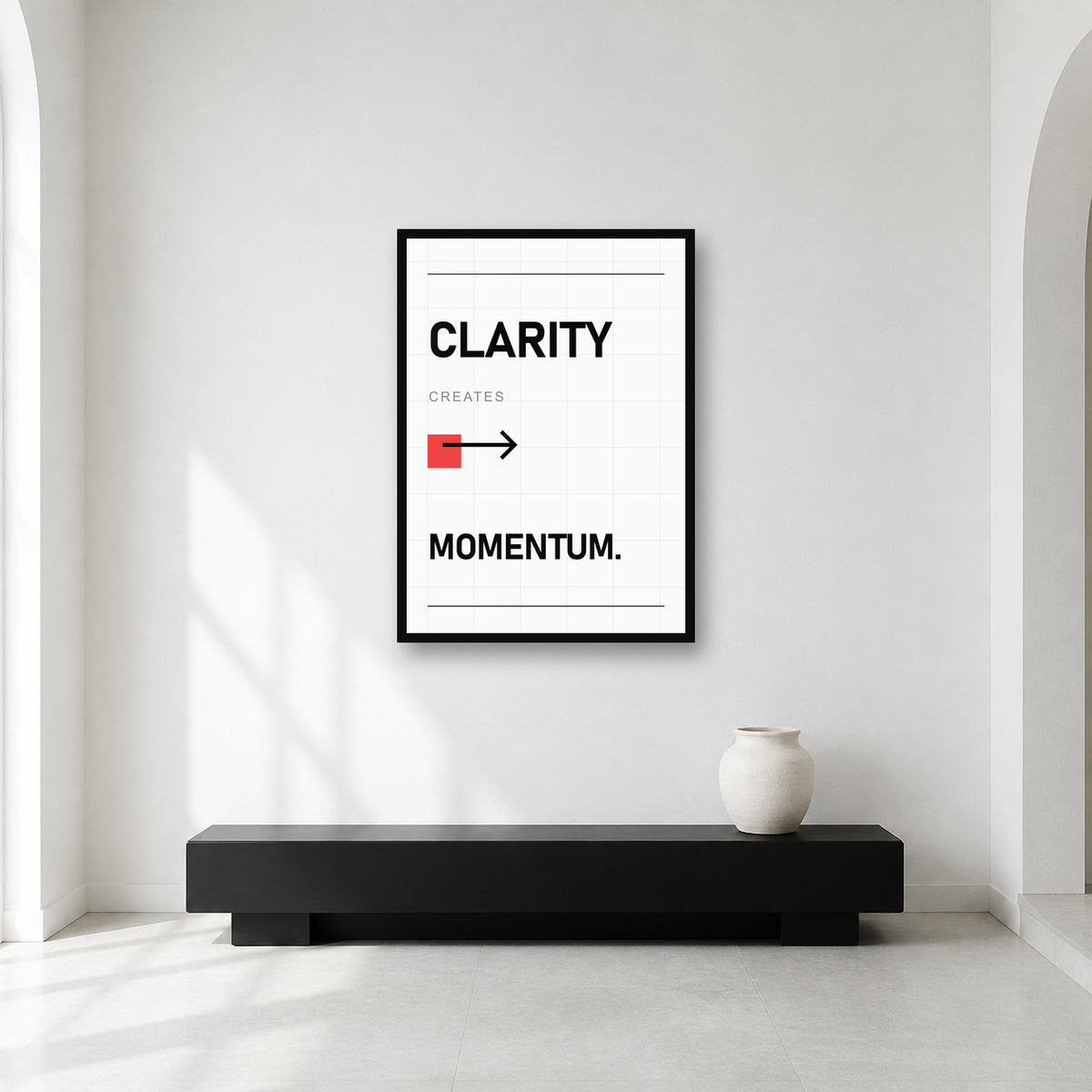Clarity Creates Momentum wall art styled in a minimal workspace
